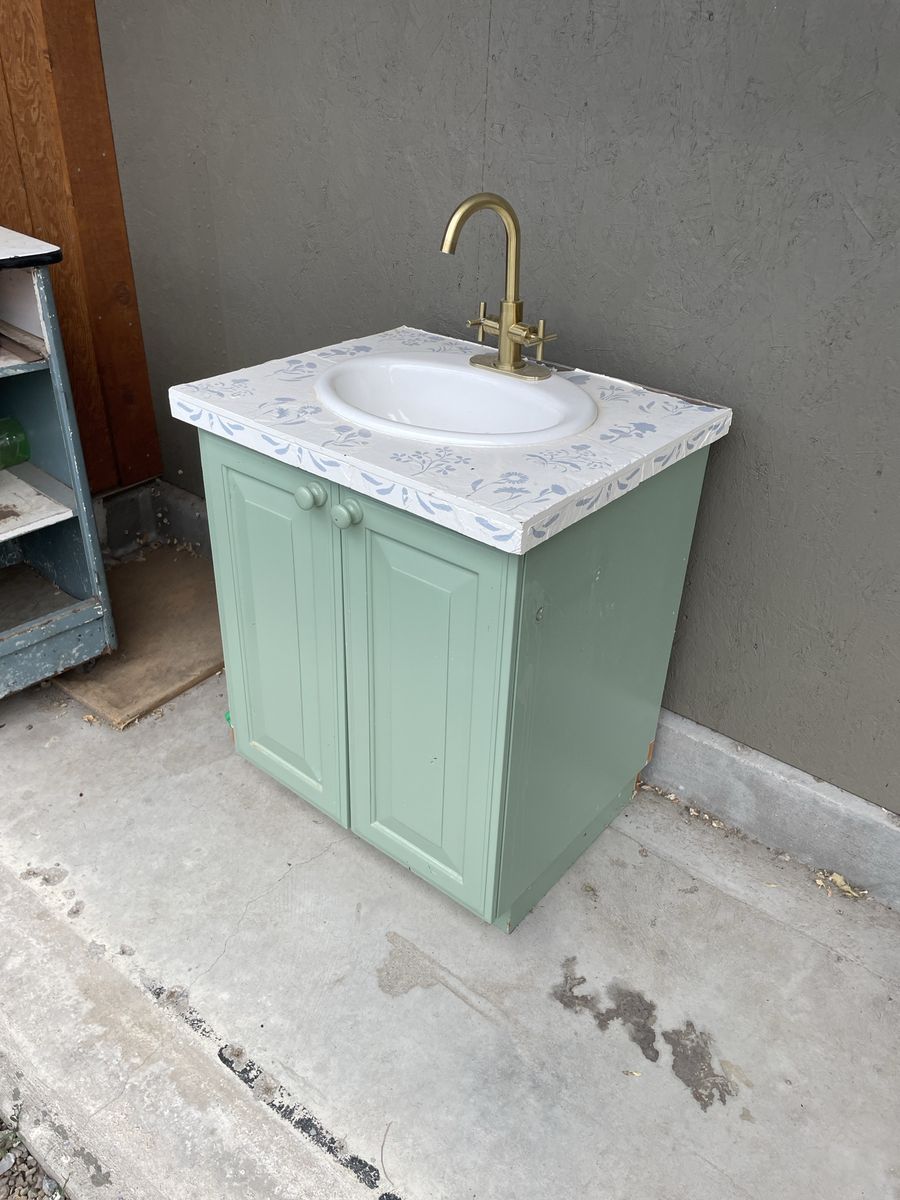 Used Bathroom Vanity with Sink. Faucet is likely no good. The top is 28 inches wide by 23 inches deep and the cabinet is 34 3/4.