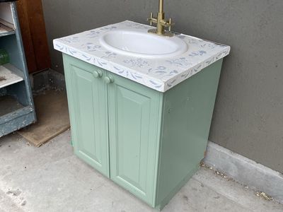 Used Bathroom Vanity with Sink. Faucet is likely no good. The top is 28 inches wide by 23 inches deep and the cabinet is 34 3/4.