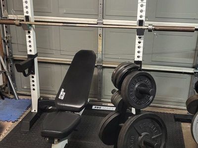 Bench and 260 pounds of weights