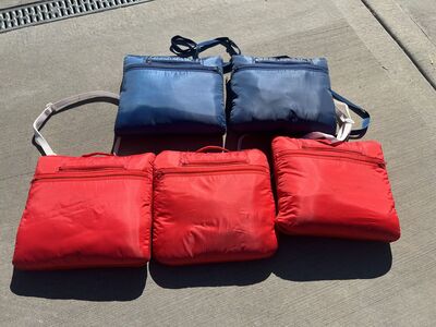 3 red, 2 blue wearable stadium blankets with hoods
