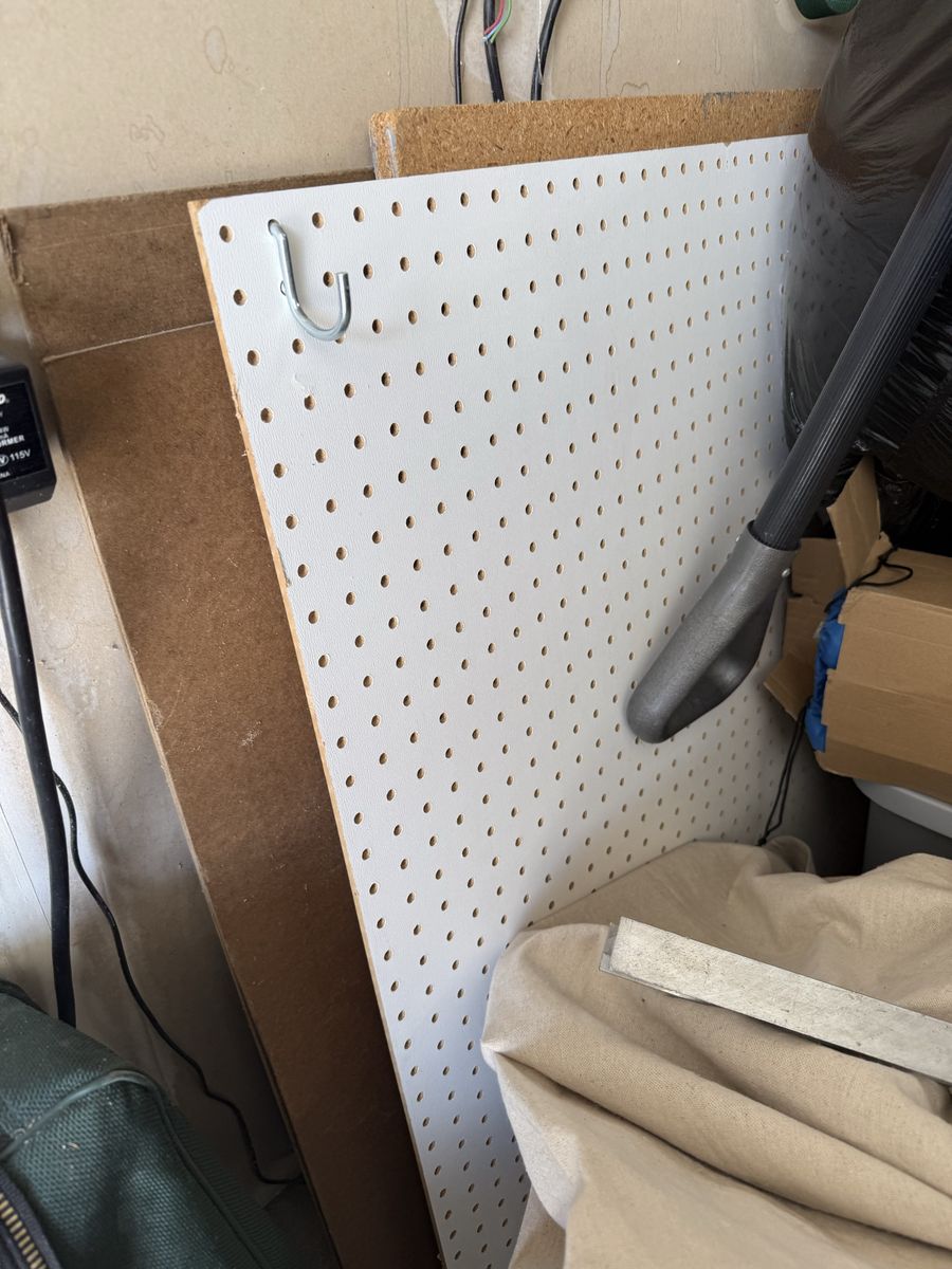Assorted Lumber, Wood Planks, and Pegboard Panels for DIY Projects