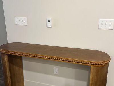 Dark Carmel colored entryway table with beading
