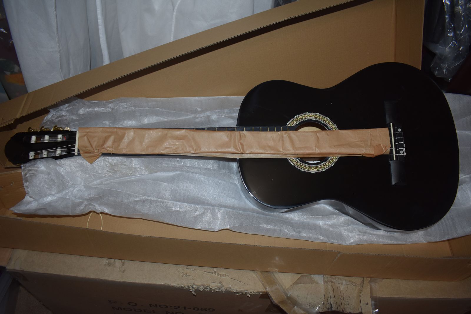 MSA black acoustic guitar