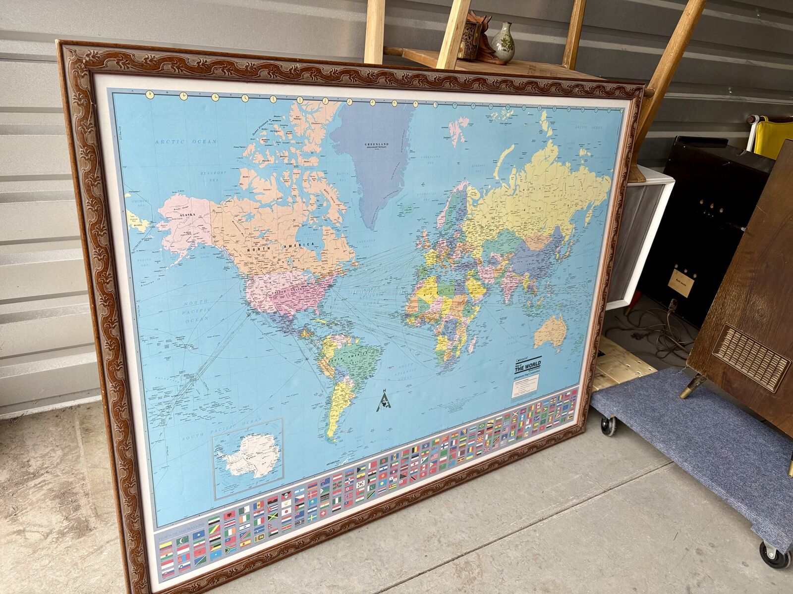 Beautifully framed world map wall hanging. Carved wooden frame. Over 4’ wide . Colorprint Map Of the World