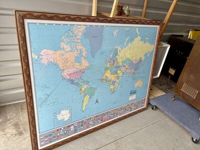 Beautifully framed world map wall hanging. Carved wooden frame. Over 4’ wide . Colorprint Map Of the World
