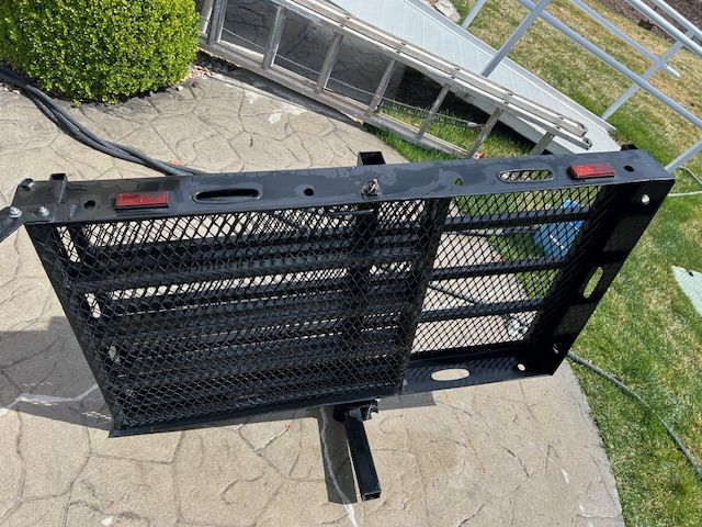 Folding wheelchair/cargo carrier with ramp