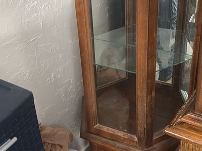 Beautiful dark oak curio cabinet with 3- glass shelves