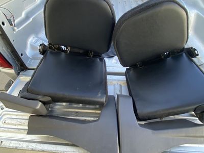 The 2003 Ford Ranger Super Cab XLT FX4 features two inward-facing rear "jump" seats.