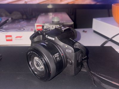 Canon EOS R100 Mirrorless Camera with RF 50mm f/1.8 STM Lens