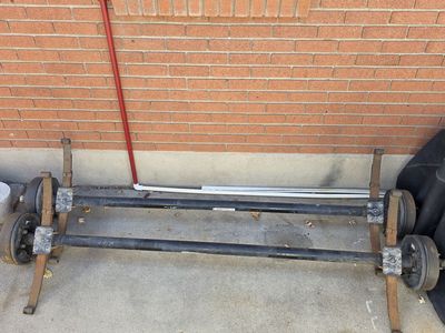 3500lbs axles - one bent, good for parts, one is in good shape
