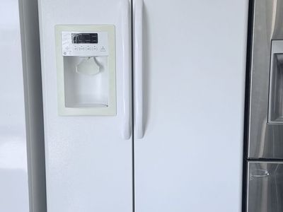 GE White Side-by-Side Refrigerator with Water Dispenser Used Good