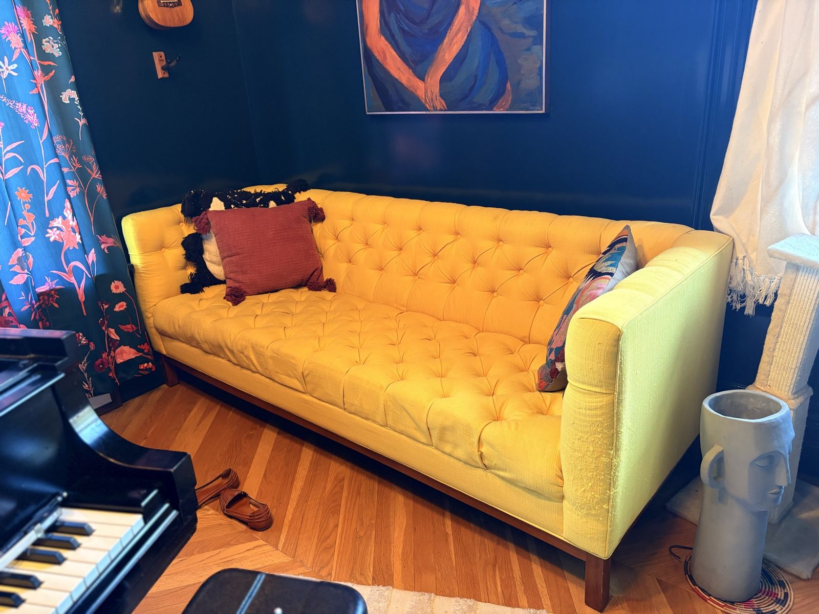 Yellow tufted couch