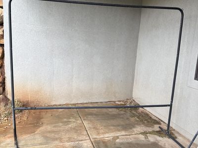 Outdoor movie screen and frame