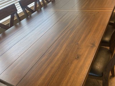 Wooden Dining Room Table Set with X-Back Chairs and Upholstered Seats. 85x42. Additional 18inch self storing leaf. $1100 OBO