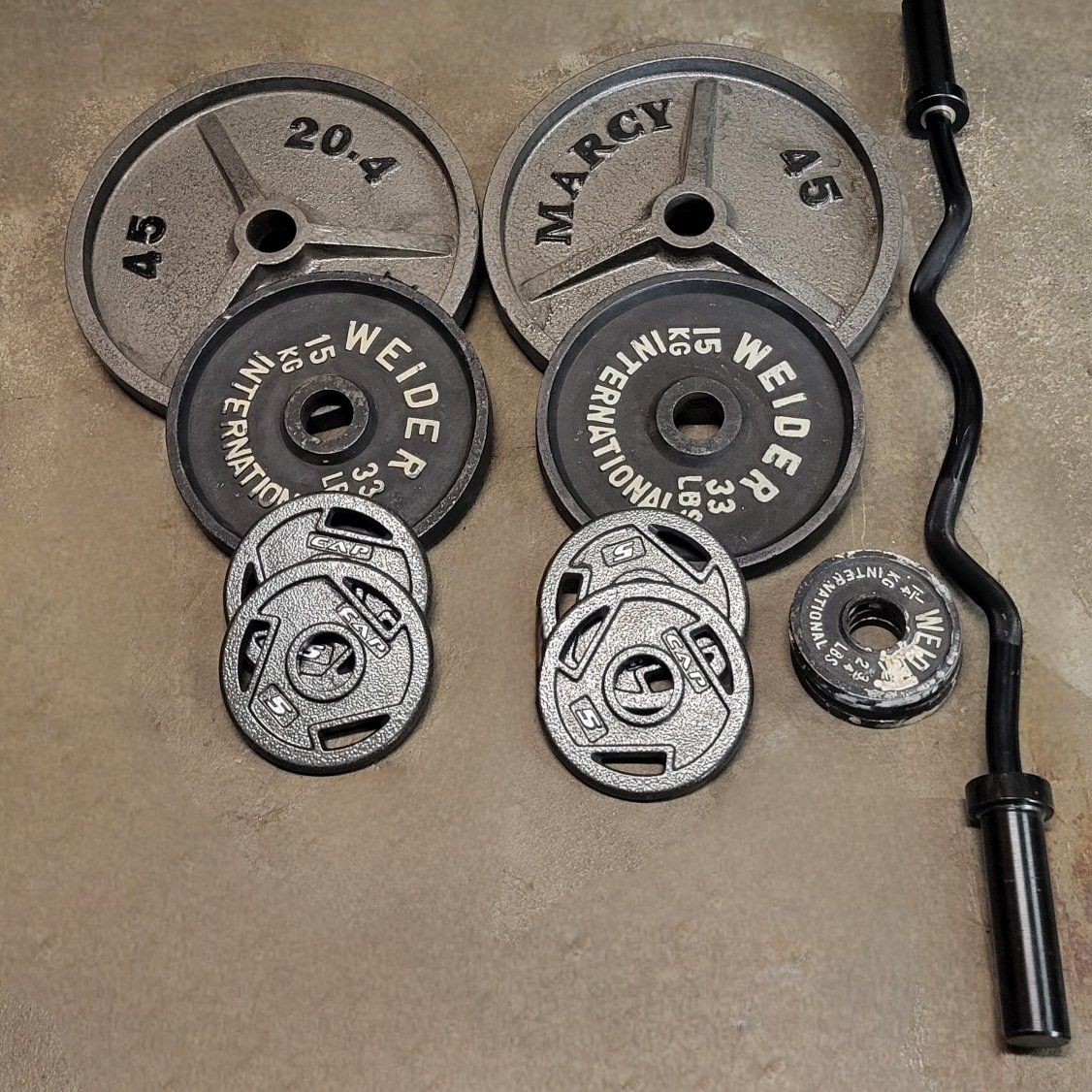 180 pounds of Olympic weights