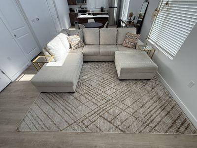Large Beige sectional with matching ottoman