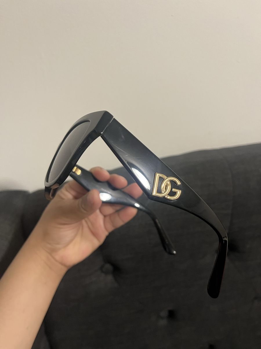 Burberry black sunglasses with a tan case. They are in excellent condition.