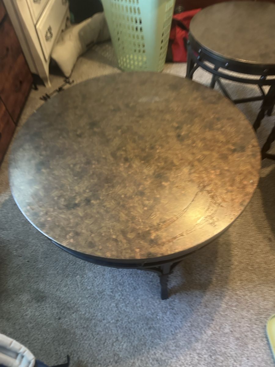 round coffee table and two end tables