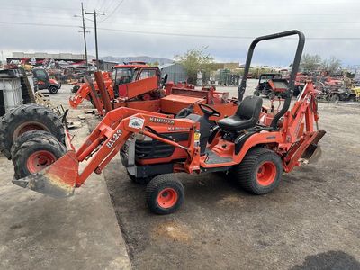 Kubota BX23 with Loader Bucket, Backhoe, Mower, & Tiller