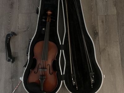 violin with two bows and a shoulder rest