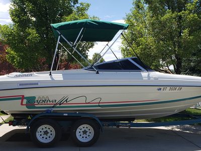 21 foot Rinker Captiva Bowrider Powerboat with Bimini Top and Trailer