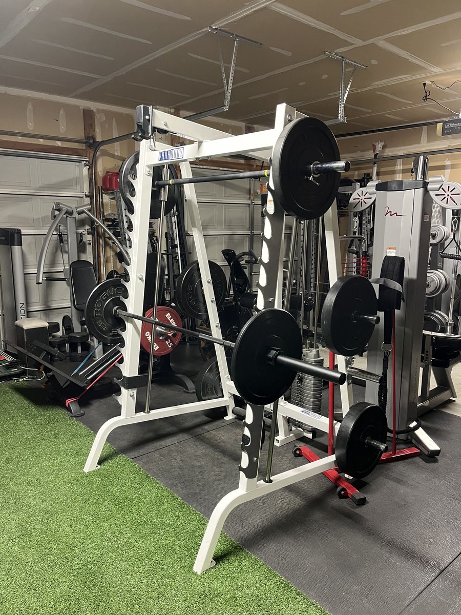 $3800  LIFE FITNESS SMITH MACHINE & ROGUE WEIGHTS