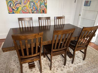 Spacious Dark Wood Dining Table with 6 Matching Chairs - Trestle Base, Studded Trim