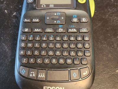 Epson Label maker with a full roll of labels. Works great (batteries not included.)