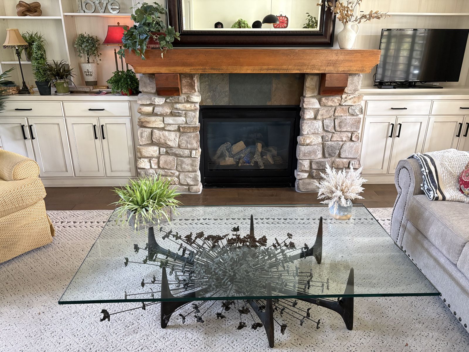 gLASS AND ORNAMENTAL IRON COFFEE TABLE.
