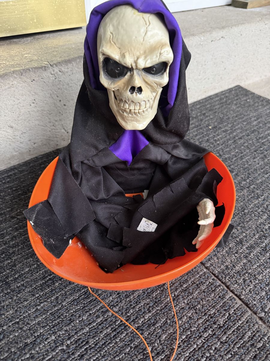 Animated Skeleton in Orange Pumpkin Bucket Halloween Decoration