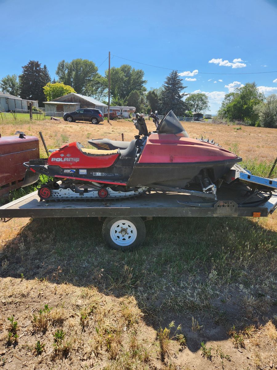 2 snowmobiles and trailer