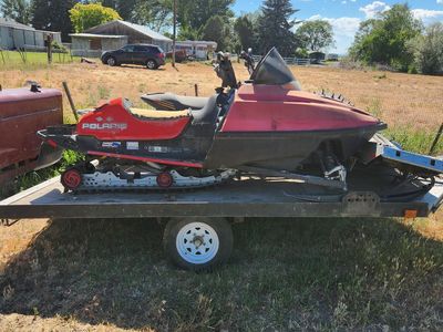 2 snowmobiles and trailer