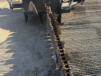 Skid Steer Trencher Attachment Rental – Fast Trenching for Utilities, Sprinklers & Drainage