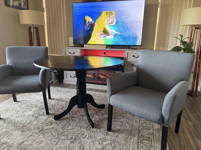 Space-Saving Black Drop-Leaf Pedestal Dining Table - Compact Design for Small Spaces