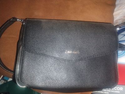 Calvin klein perse Steve person and a black purse