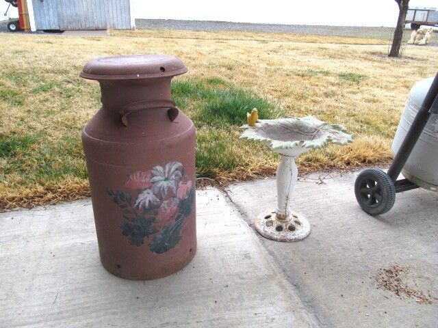 Yard decor. Birdbath and milk jug $25 ea.