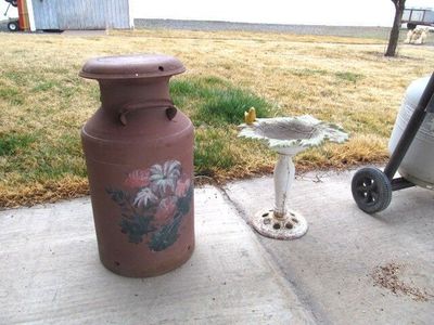 Yard decor. Birdbath and milk jug $25 ea.
