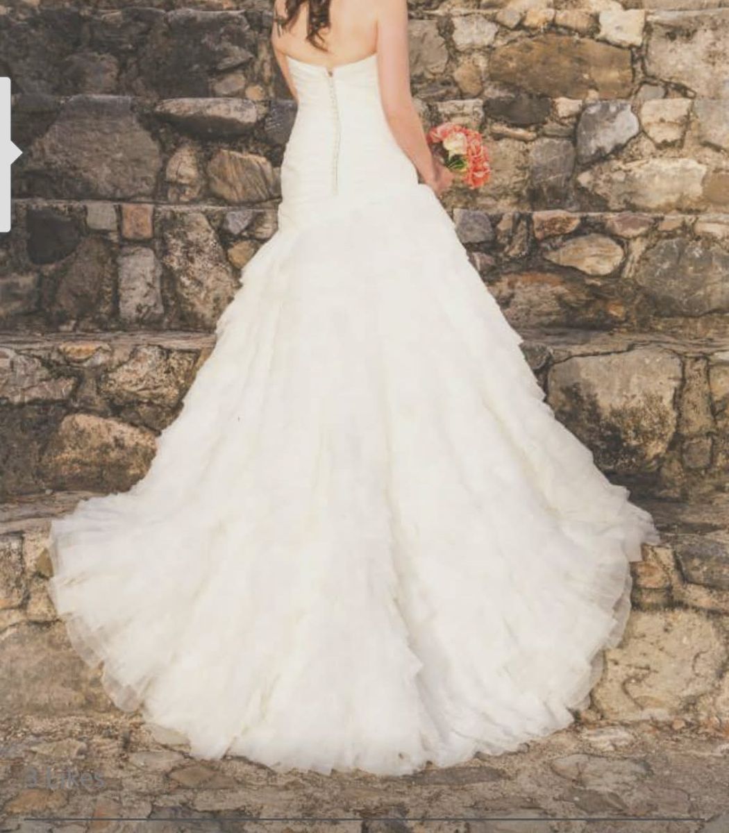 Women’s size 10 off strapless wedding dress.