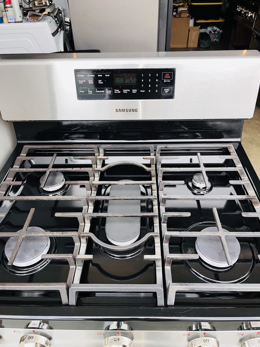 $1250 OBO NEW DENT FRIDGE AND USED GAS RANGE