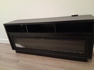 Black TV Stand with Built-In Electric Fireplace and Storage Shelves
