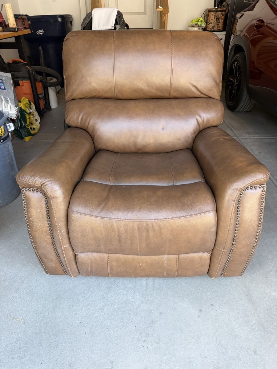 Brown leather rocking power recliner