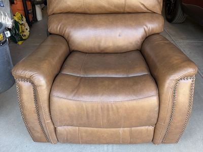 Brown leather rocking power recliner