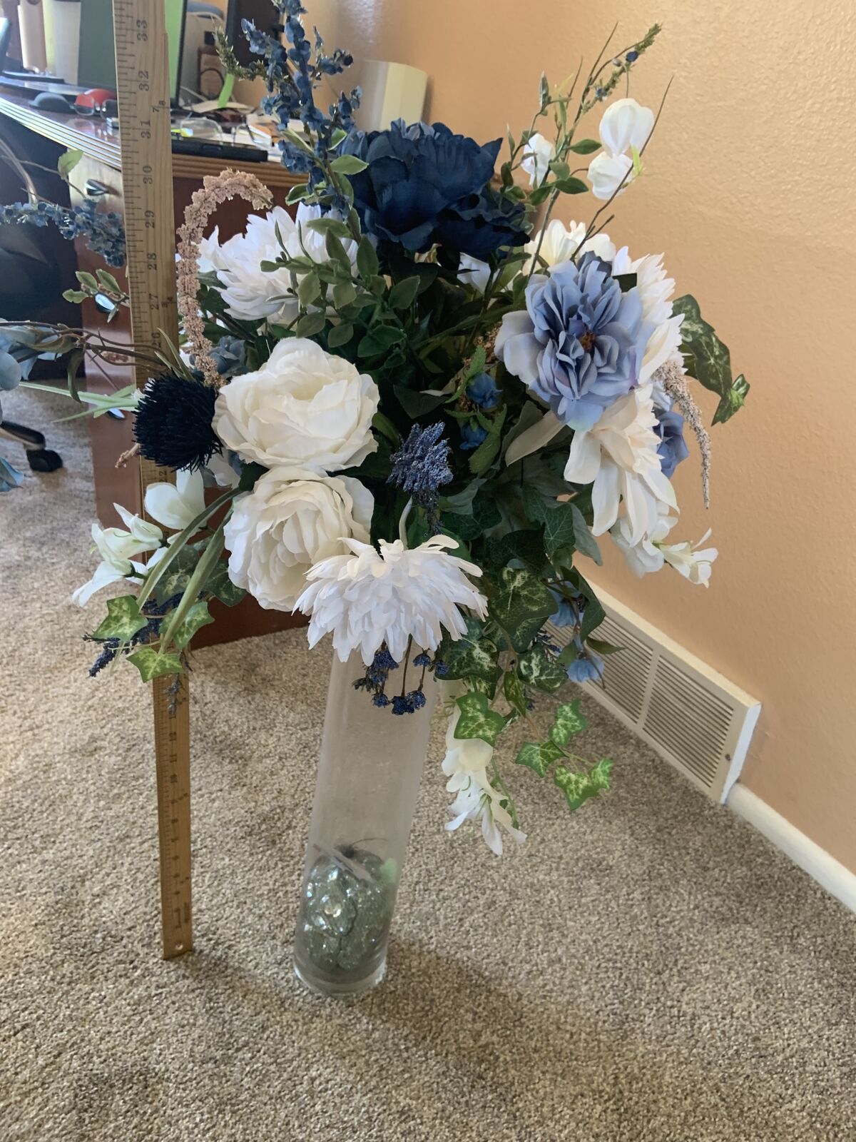 Blue and white fake flowers in vase