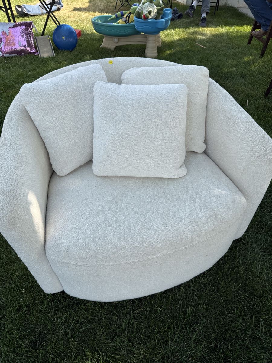 2 white swivel chairs