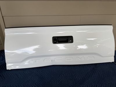 2016-2023 Toyota Tacoma complete tailgate assembly with minor damage.