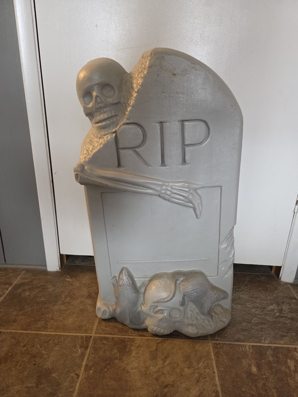 vintage TPI blow mold Halloween decoration featuring an "RIP" tombstone with a skeleton and rats