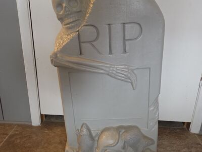 vintage TPI blow mold Halloween decoration featuring an "RIP" tombstone with a skeleton and rats