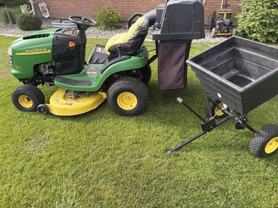 John deere L110 with bagger and spreader