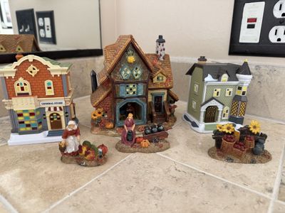 Cute little fall village set the little pieces do have a few chips out of them as shown