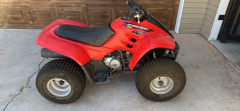 Red Honda Sportrax 90 Four Wheeler